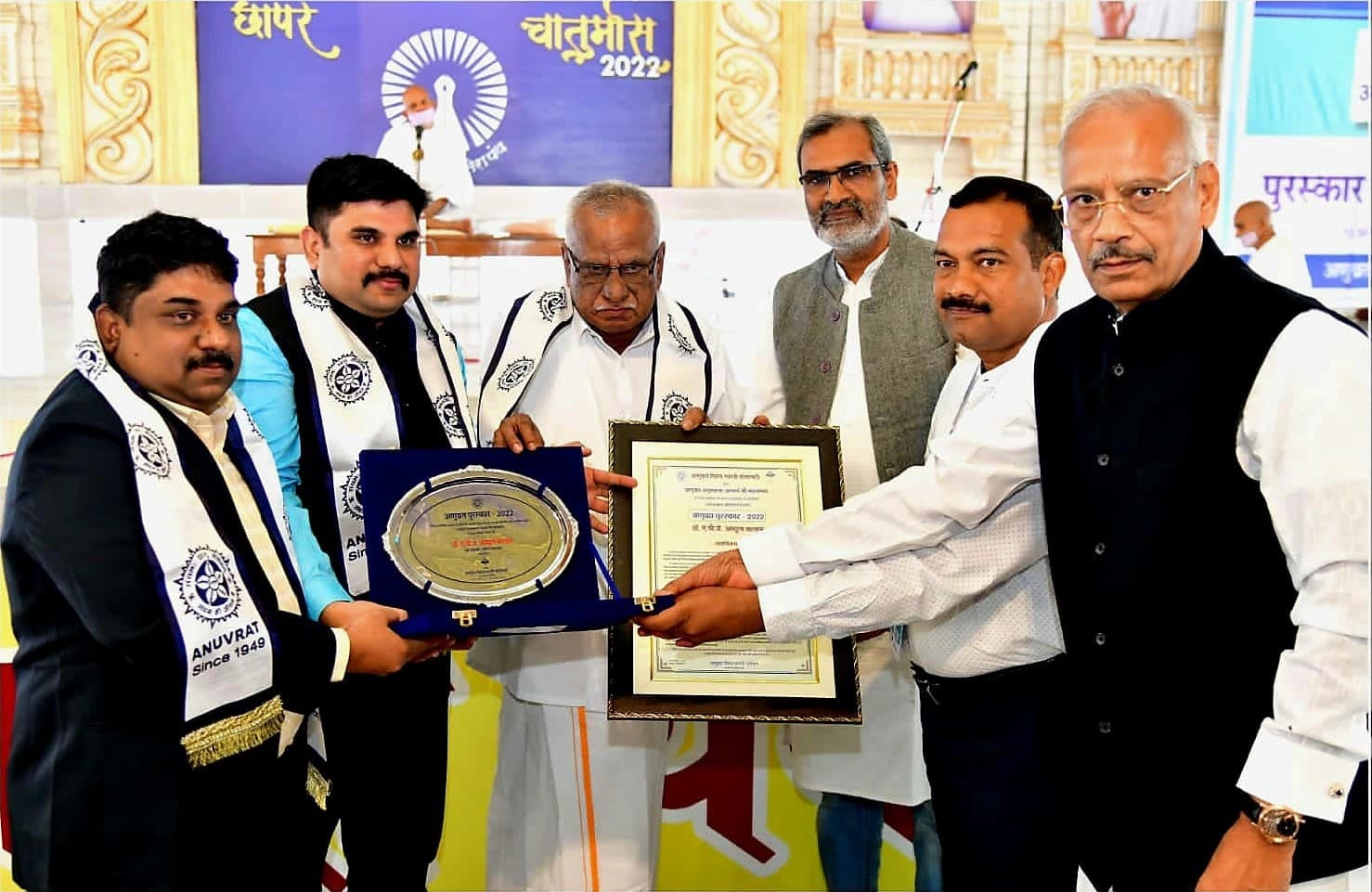The Anuvrat Puraskar 2022 citation and commemorative plaque held by Dr. APJMJ Sheik Saleem and the Anuvrat Vishwa Bharati Society office bearers